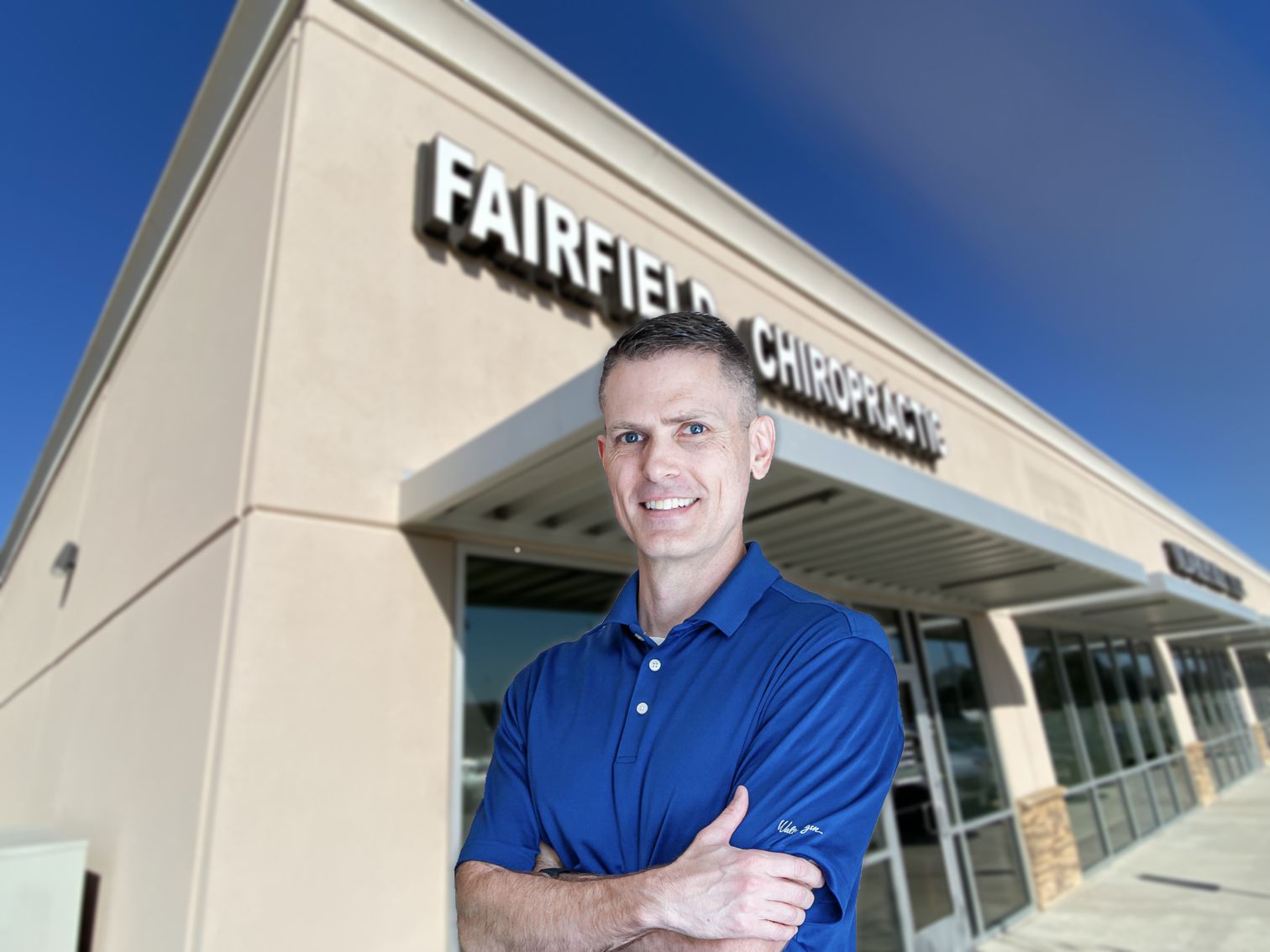 Dr. Paul Willmon stands in front of his chiropractic business